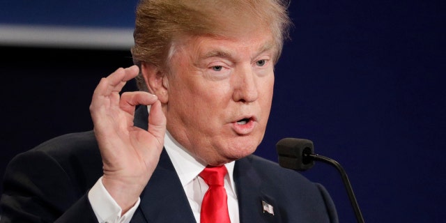 Republican presidential nominee Donald Trump answers a question during the third presidential debate at UNLV in Las Vegas, Wednesday, Oct. 19, 2016. (AP Photo/John Locher)