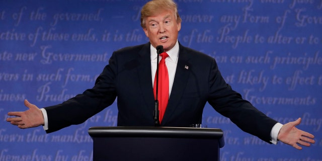 Republican presidential nominee Donald Trump speaks during the third presidential debate with Democratic presidential nominee Hillary Clinton at UNLV in Las Vegas, Wednesday, Oct. 19, 2016. (AP Photo/David Goldman)
