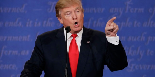 Republican presidential nominee Donald Trump speaks to Democratic presidential nominee Hillary Clinton during the third presidential debate at UNLV in Las Vegas, Wednesday, Oct. 19, 2016. (AP Photo/David Goldman)