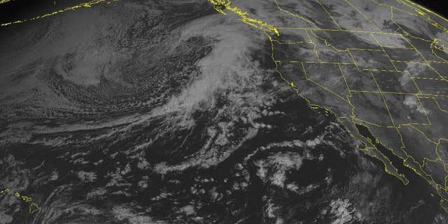 This NOAA satellite image taken Thursday, Oct. 16, 2014 at 2:00 p.m. EDT, shows Tropical Storm Ana 490 miles southeast of Hilo, Hawaii with maximum winds of 60 miles per hour moving westward. Ana should pass just to the south of the Hawaiian island chain and may clip the island of Kauai. On the mainland, an area of low pressure moves into the Pacific Northwest with heavy rain. High pressure dominates over the southwestern Untied States with mostly sunny skies. (AP Photo/ Weather Underground