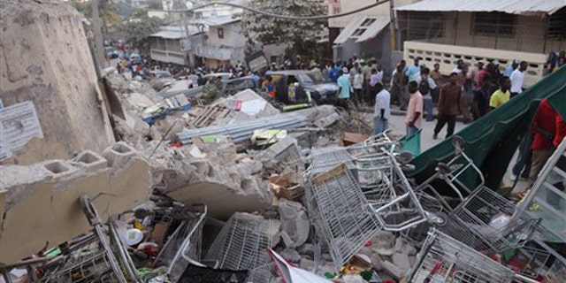 Debris lays in the street after an earthquake along the Delmas road in Port-au-Prince, Haiti, Wednesday, Jan. 13, 2010. (AP)