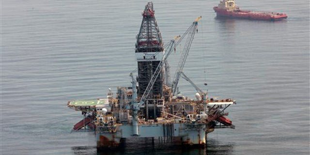 FILE: A deepwater drilling rig operates near the site of the Deepwater Horizon disaster in the Gulf of Mexico on June 8, 2010.