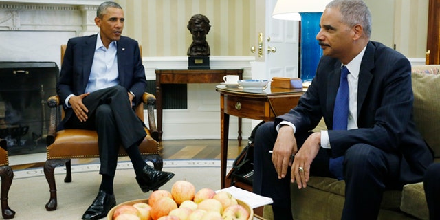 President Barack Obama meets with Attorney General Eric Holder (AP Photo/Charles Dharapak)
