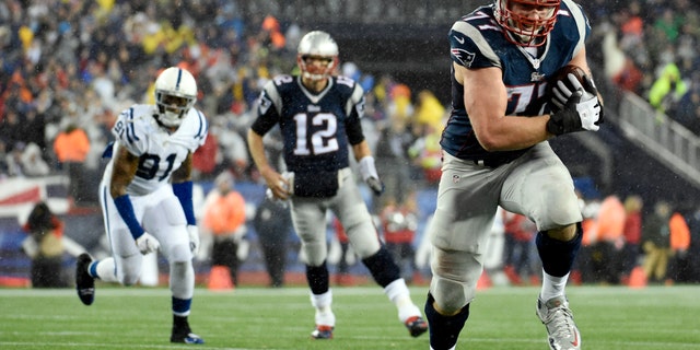 File photo - Jan 18, 2015, New England Patriots tackle Nate Solder (77) catches a pass from quarterback Tom Brady (12) and runs for a touchdown against the Indianapolis Colts in the third quarter in the AFC Championship Game at Gillette Stadium. (Robert Deutsch-USA TODAY Sport)