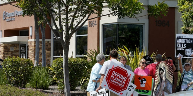 FILE: August 3, 2015: Protesters outside a Planned Parenthood clinic in Vista, California.