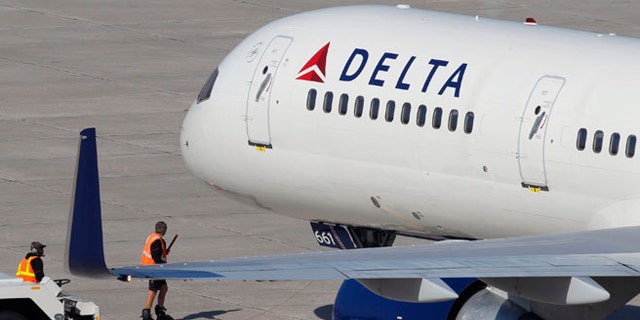A Delta Air Lines pilot is being praised for turning a plane back towards the gate to pick up a family traveling to their father's funeral.