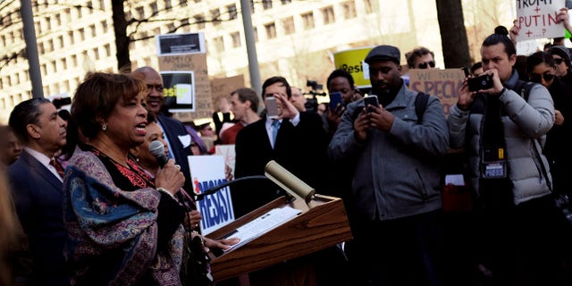 The Michigan Democrat was seen playing a game on her phone.