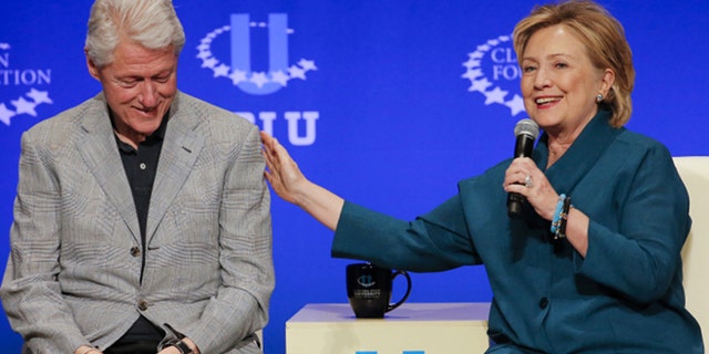 Former President Bill Clinton and Hillary Rodham Clinton are shown in this AP photo.