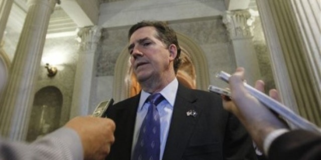 Sen. Jim DeMint talks with reporters near the Senate floor on Capitol Hill Dec. 22, 2010.