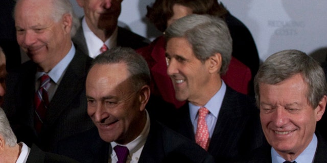 Wednesday: Sen. John Kerry shared a laugh with other Senate Democrats during a health care news conference. (AP Photo)