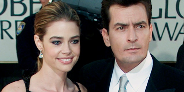 January 20, 2002. Charlie Sheen and fiance Denise Richards pose during arrivals at the 59th annual Golden Globe Awards in Beverly Hills.