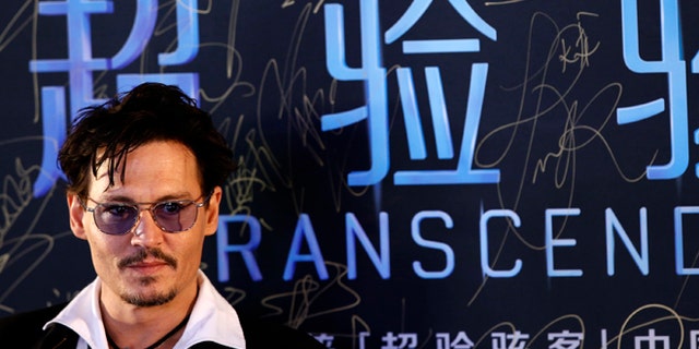 Actor Johnny Depp attends a red carpet event to promote his new movie "Transcendence", on his first visit to China in Beijing March 31, 2014.REUTERS/Kim Kyung-Hoon (CHINA - Tags: ENTERTAINMENT) - RTR3JBV1