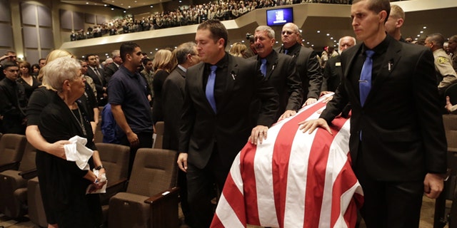 Thousands of law enforcement officials and members of the community gather for a memorial service of slain Los Angeles County Sheriff's Sgt. Steve Owen at Lancaster Baptist Church Thursday, Oct.13, 2016 in Lancaster, Calif.