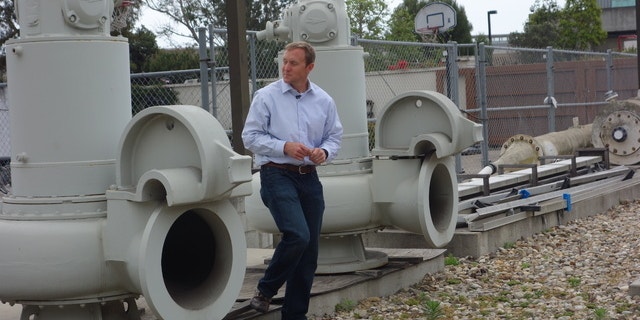 Joshua Haggmark, interim resources manager for Santa Barbara, Calif., looks at equipment that was brought up from the ocean floor after the city shut down its desalination plant more than two decades ago. (AP)