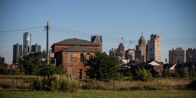 An abandoned home is seen with the Detroit skyline in the background on September 5, 2013 in Detroit, Michigan.
