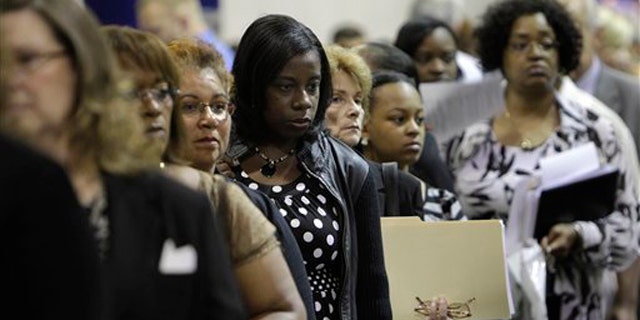 In this Aug. 25 photo, job seekers attend a job fair in Southfield, Mich. (AP Photo)