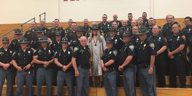 Lauren Rich had 39 Indiana police officers at her high school graduation on Saturday.