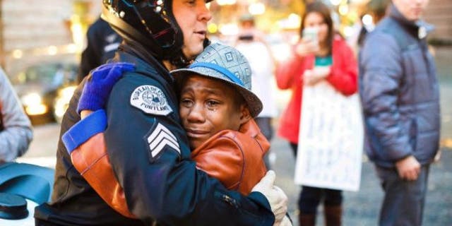 Devonte Hart, 12, was photographed at a rally in Portland, Ore. in November 2015.