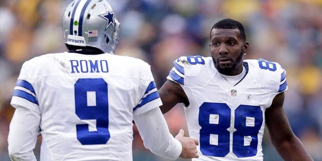 GREEN BAY, WI - JANUARY 11: Tony Romo #9 and Dez Bryant #88 of the Dallas Cowboys wait for an officials' review during the 2015 NFC Divisional Playoff game at Lambeau Field on January 11, 2015 in Green Bay, Wisconsin. (Photo by Mike McGinnis/Getty Images)