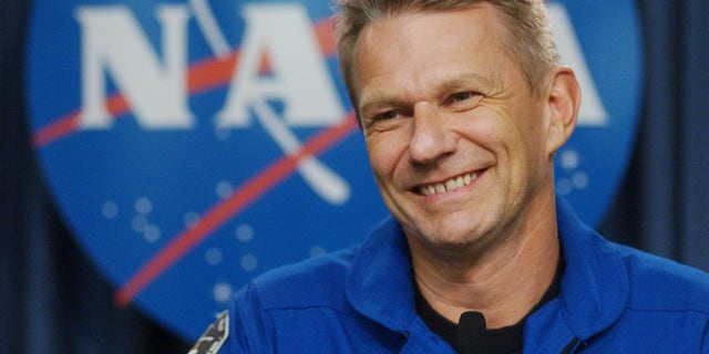 FILE - In this July 17, 2006 photo, British born U.S. Astronaut Piers Sellers talks with reporters following the safe return the space shuttle Discovery at the Kennedy Space Center in Cape Canaveral, Fla. Sellers, a climate scientist and former astronaut died Friday, Dec. 23, 2016. He was 61. (AP Photo/Pete Cosgrove, File)