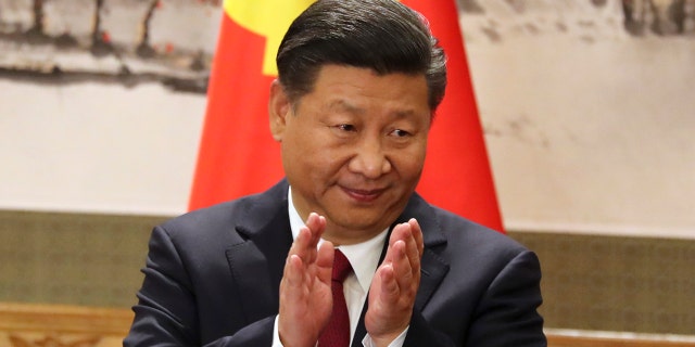 In this Oct 25, 2017, file photo, Chinese President Xi Jinping claps while addressing the media as he introduces new members of the Politburo Standing Committee at Beijing's Great Hall of the People.