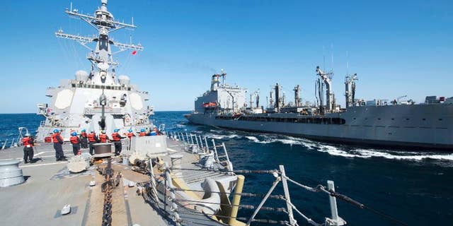 Dec. 24, 2015: Guided-missile destroyer USS Bulkeley participates in a replenishment-at-sea with fleet replenishment oiler USNS John Lenthall in the Gulf of Oman. (Mass Communication Specialist 2nd Class M. J. Lieberknecht/ U.S. Navy via AP)