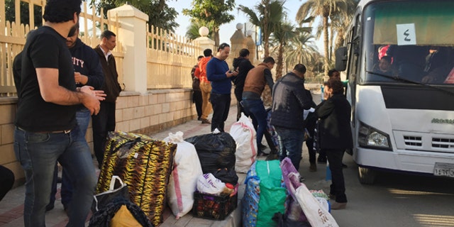 Christian families who left from Al-Arish in the North Sinai Governorate after the escalation of a campaign targeting Christians by Islamic State militants last week, arrive at the Evangelical Church in Ismailia, Egypt.