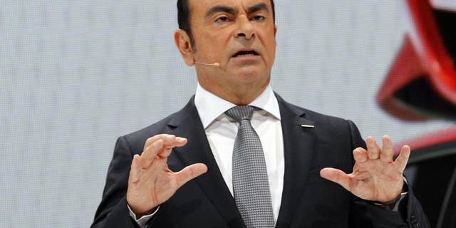 Nissan Motor Co. President and CEO Carlos Ghosn addresses the media during the presentation of the Nissan Micra as part of the first press day at the Paris Auto Show in Paris, France, Thursday, Sept. 29, 2016. The Paris Auto Show will open its gates to the public from Oct. 1st to 16th. (AP Photo/Christophe Ena)