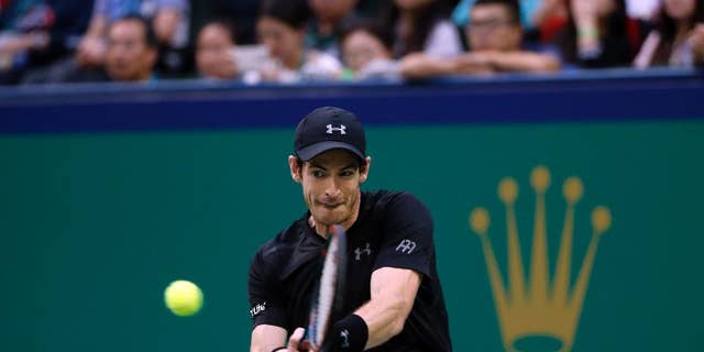 Andy Murray of Britain hits a return shot against Roberto Bautista Agut of Spain during the men's singles final of the Shanghai Masters tennis tournament at Qizhong Forest Sports City Tennis Center in Shanghai, China, Sunday, Oct. 16, 2016. (AP Photo/Andy Wong)
