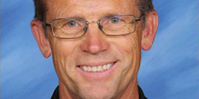 Junior high teacher Robert Crosland faces charge for allegedly feeding a puppy to a snapping turtle in front of students.