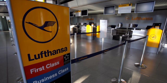An unstaffed Lufthansa check-in counter is pictured in Berlin, Germany, Wednesday, April 2, 2014. Germany's biggest airline Lufthansa will cancel some 3,800 flights because of a three-day strike by the pilots' union, affecting more than 425,000 passengers. The cancellations include domestic and intercontinental connections Wednesday, Thursday and Friday. (AP Photo/Michael Sohn)