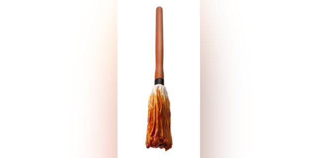 Barbecue Sauce Basting Mop with a Wooden Handle. This cooking utensil is a cut out, isolated on a white background.