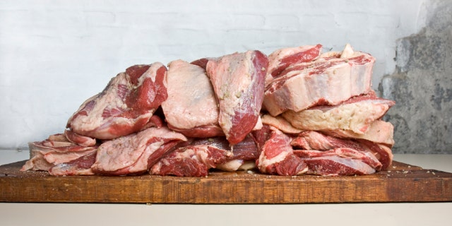 Seasoned tri-tip(colita de cuadril -or santa maria steak) and short ribs (asado de tira) ready for a huge traditional Uruguayan barbeque for 30 people.