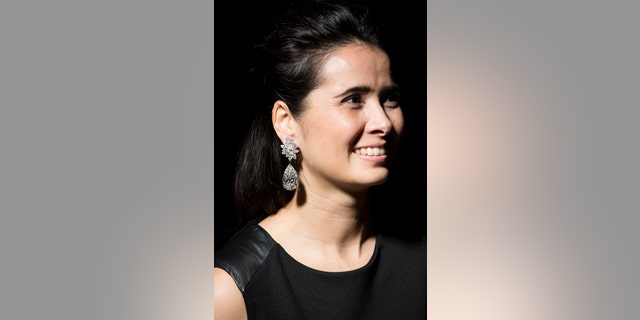 A model displays a pair of stunning diamond earrings "Miroir de l'Amour" weighing 52.55 and 50.47 carats during a Christie's press preview in Geneva, Switzerland, Thursday, Nov. 10, 2016.