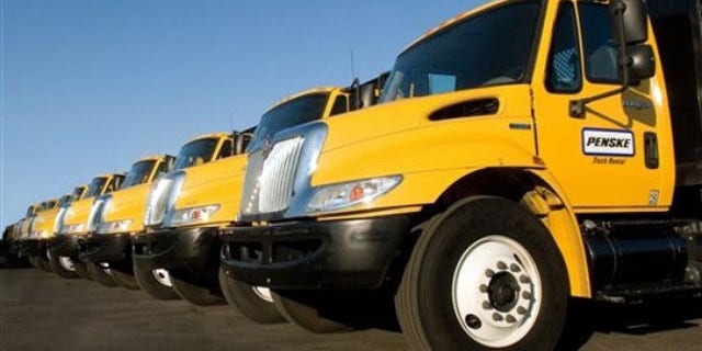 Diesel-powered flatbed trucks from Penske Corp.