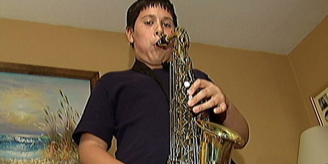 Cathy DiMarzio, of Raynham, said her son Andrew, seen above, was recently told that his 31-inch by 12-inch saxophone case would no longer be allowed on Bus 9 within the Bridgewater-Raynham Regional School District because the bus is filled to capacity and the instrument creates a safety hazard.