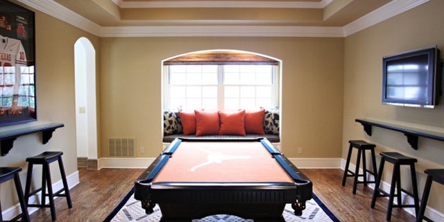 This dining room was re-envisioned as an entertainment room, with a dining table swapped out for a billiards table.