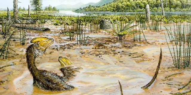 Two small Guanlong wucaii dinosaurs struggle to escape a muddy pit in what is now China during the late Jurassic period.