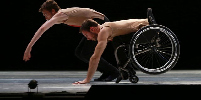 Dancers from the United Kingdom's Candoco Dance Company perform a piece called "Let's Talk About Dis" at the Guanajuato State Auditorium during the 43rd edition of the Cervantino International Festival in Guanajuato, Mexico, Sunday, Oct. 11, 2015. The Candoco Dance Company mixes disabled and non-disabled dancers in many of its choreographies. (AP Photo/Mario Armas)