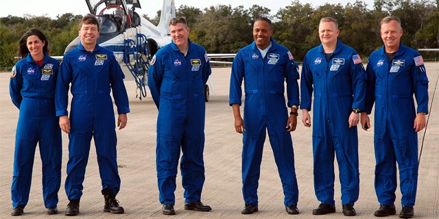Space shuttle Discovery's STS-133 crew arrives at NASA's Kennedy Space Center on Feb. 20, 2011. From left: Nicole Stott, Michael Barratt, Steve Bowen, Al Drew, Eric Boe and Steven Lindsey.