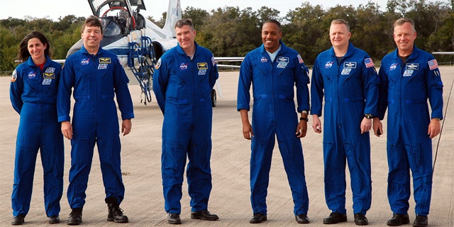 Space shuttle Discovery's STS-133 crew arrives at NASA's Kennedy Space Center on Feb. 20, 2011. From left: Nicole Stott, Michael Barratt, Steve Bowen, Al Drew, Eric Boe and Steven Lindsey.