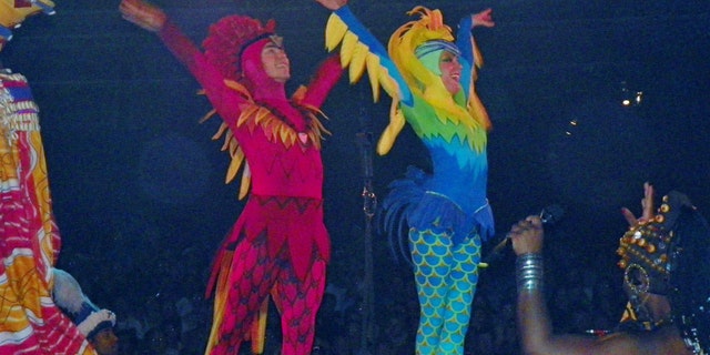 Crowder, right, claims that was unjustly terminated as an aerial performer in the Festival of the Lion King show at Disney's Animal Kingdom Park after her maternity leave.