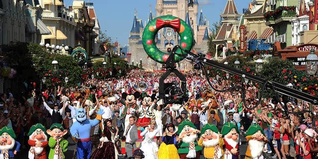 (Dec. 7, 2013): Joined by hundreds of Disney characters and performers, Emmy Award-winning actor Neil Patrick Harris tapes a musical number Dec. 7, 2013 for the Disney Parks Christmas Day Parade TV special at the Magic Kingdom park at Walt Disney World Resort in Lake Buena Vista, Fla. In addition to performing, Harris is one of the hosts of the annual holiday special. The 30th annual holiday telecast airs December 25 on ABC-TV. The show also will air in Canada on CBC Network, and across the globe on the American Forces Network. (Mark Ashman, photographer)