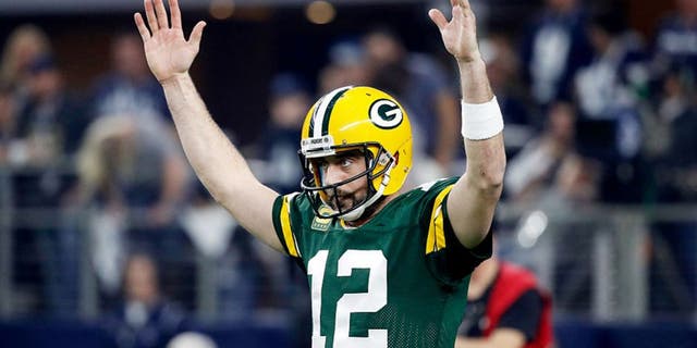 ARLINGTON, TX - JANUARY 15: Aaron Rodgers #12 of the Green Bay Packers reacts after scoring a touchdown in the first half during the NFC Divisional Playoff Game against the Dallas Cowboys at AT&amp;T Stadium on January 15, 2017 in Arlington, Texas. (Photo by Joe Robbins/Getty Images)