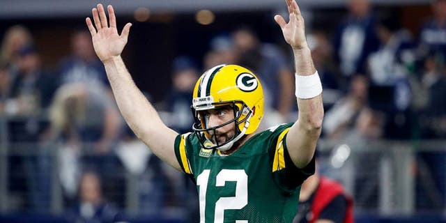 ARLINGTON, TX - JANUARY 15: Aaron Rodgers #12 of the Green Bay Packers reacts after scoring a touchdown in the first half during the NFC Divisional Playoff Game against the Dallas Cowboys at AT&T Stadium on January 15, 2017 in Arlington, Texas. (Photo by Joe Robbins/Getty Images)