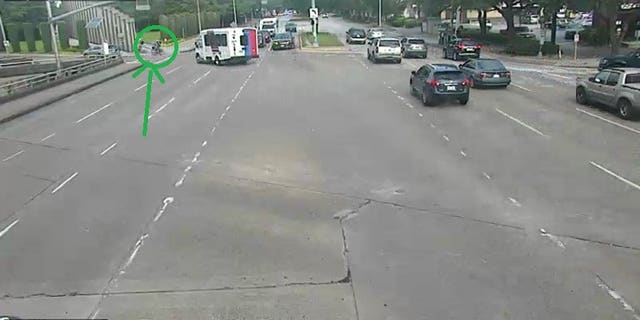 Dr. Mark Hausknecht, circled in green, riding his bike Friday morning.