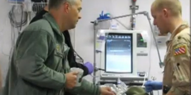 Army Lt. Colonel John Chovanes, a trauma doctor at Cooper University Hospital, is pictured above left.