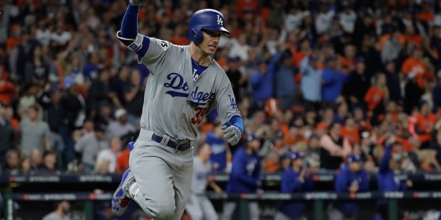 Los Angeles Dodgers' Cody Bellinger reacts after hitting an RBI double during the ninth inning of Game 4 of baseball's World Series against the Houston Astros Saturday, Oct. 28, 2017, in Houston. (AP Photo/David J. Phillip)