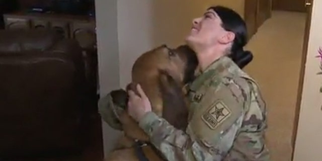 Army Pvt. Katlyn Gallagher and her dog Buck.