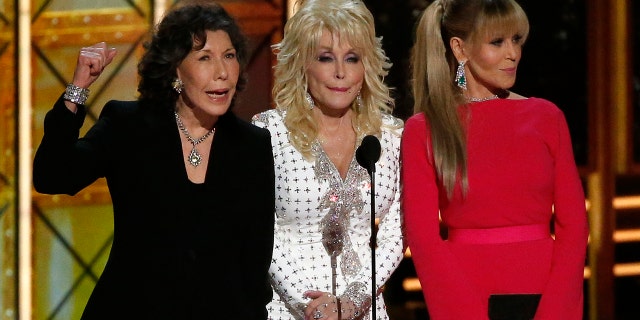 Dolly Parton (center) remained tight lipped when Lily Tomlin (left) and Jane Fonda (right) cracked a Trump joke at the 2017 Emmys.